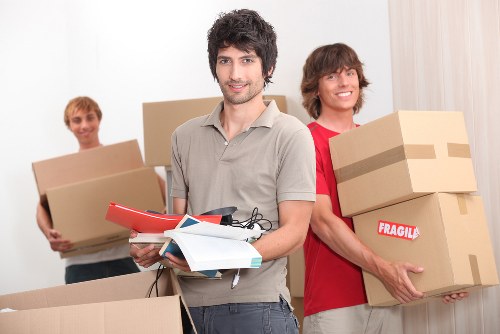Packed office boxes and furniture ready for local business transport