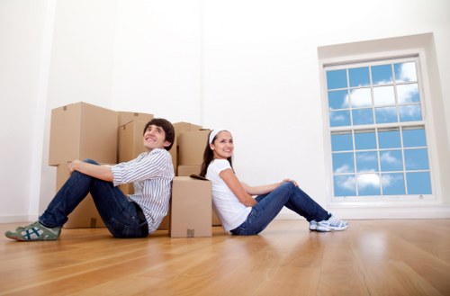 Movers carefully handling furniture during a home move in Edgware