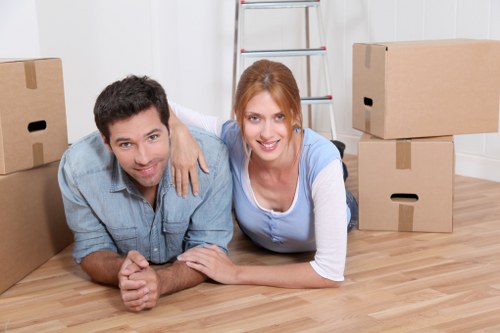 Office desks and equipment being handled during a business relocation